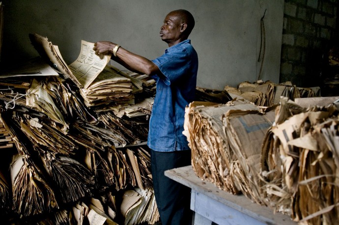 A technician takes care of botanic samples in the semi-abandoned 