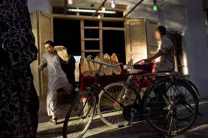 A boy get out of a bread seller shop in Herat  - © Giulio Napolitano