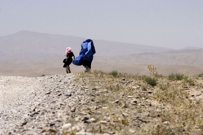 A woman wrappend in her burka on the way from Karukh to Herat  - © Giulio Napolitano