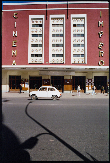 An old Fiat 600 passing by the Cinema Impero, Asmara - © Giulio Napolitano